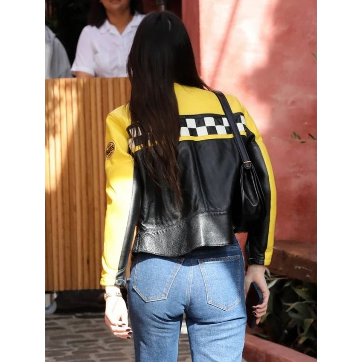 Kendall Jenner in trendy black and yellow Aspen leather jacket in USA