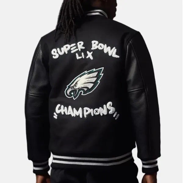 Black varsity jacket with Super Bowl LIX Champions text and logo on the back