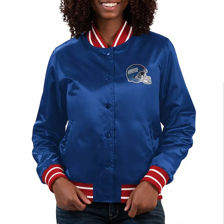 Person wearing a blue satin jacket with red and white accents on a white background in USA