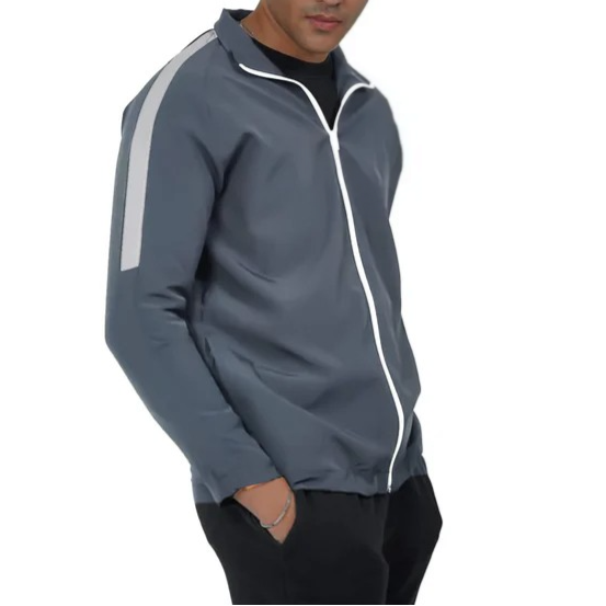 Man wearing a gray jacket with white stripes on a white background