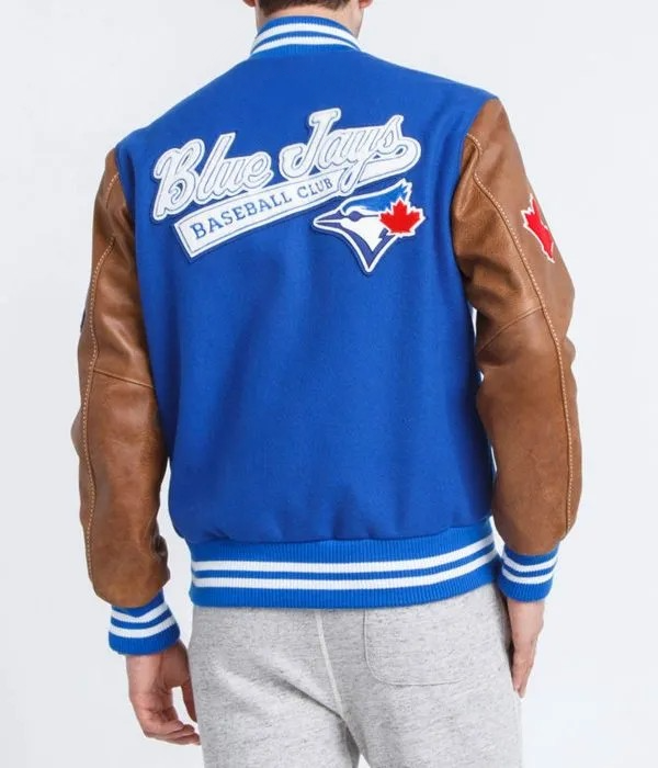 Blue Jays baseball club varsity jacket with brown leather sleeves on a white background