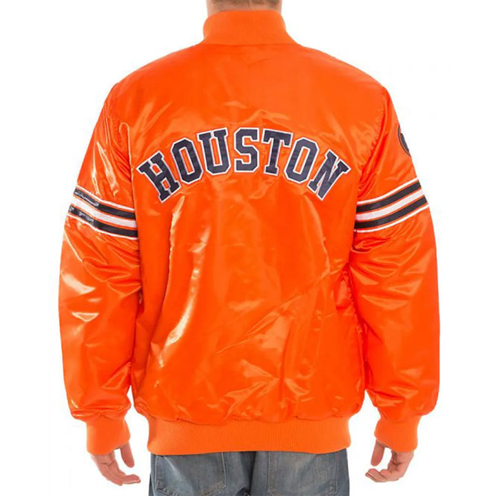Orange jacket with 'HOUSTON' text on the back, worn by a person.