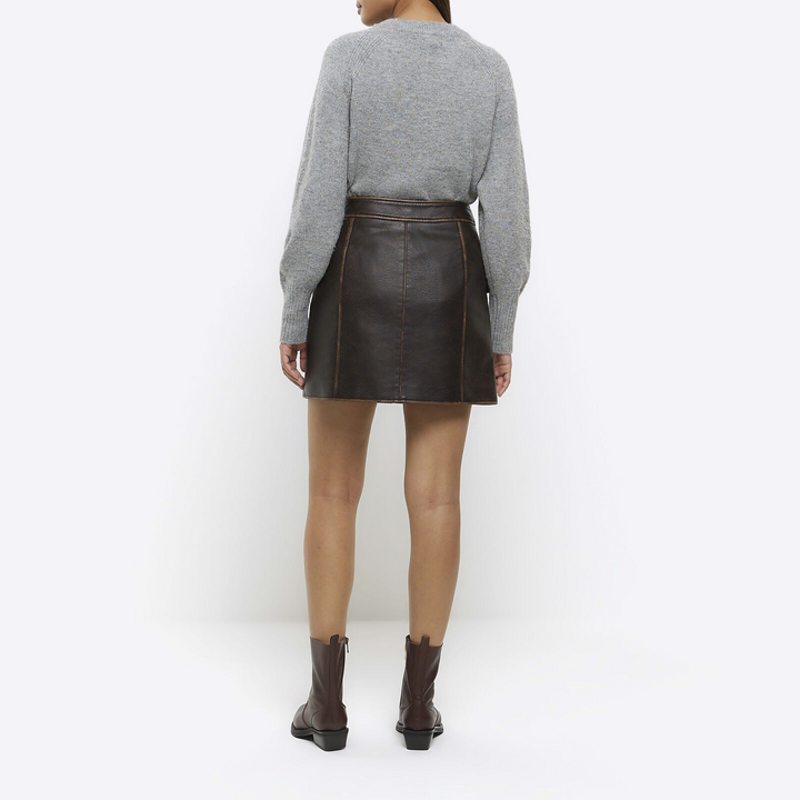 River Island brown faux leather skirt on model in American style